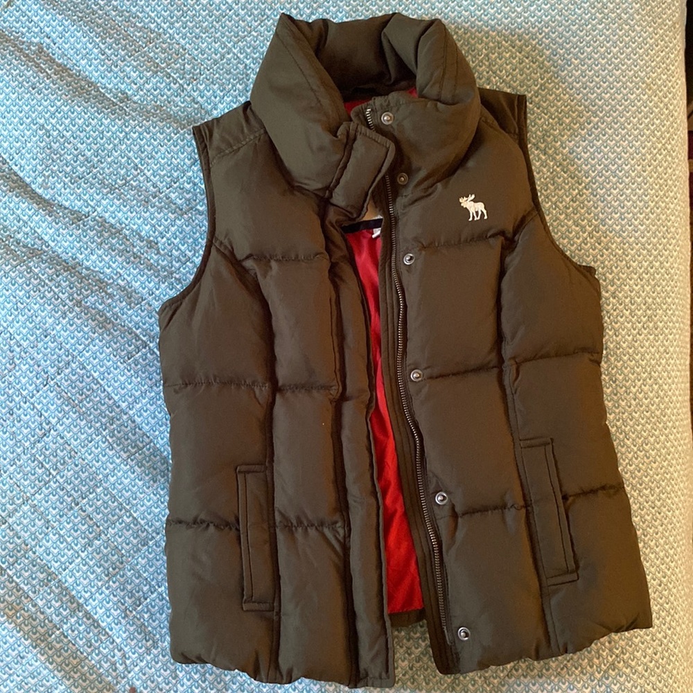 This is a dark forest green with a red liner it is a button up and a zipper